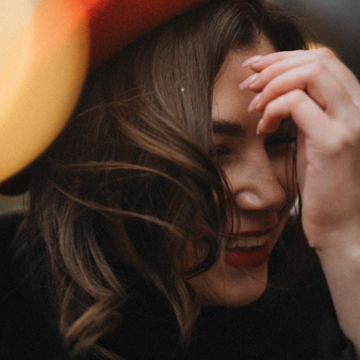 Kaveri Mehta, Lead Design Curator at Quiet Pulse Bridge, reviewing corporate floral arrangements